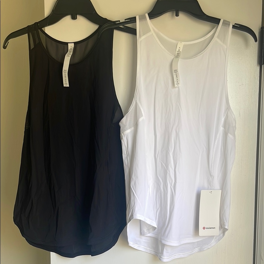LULULEMON SZ 4 WHITE SCULPT TANK II
Brand new, retails for $58!